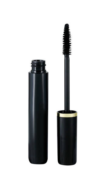 Open black mascara container and lid with applicator isolated on white Open black mascara container and brush applicator in lid isolated on white, clipping path, studio shot mascara wands stock pictures, royalty-free photos & images
