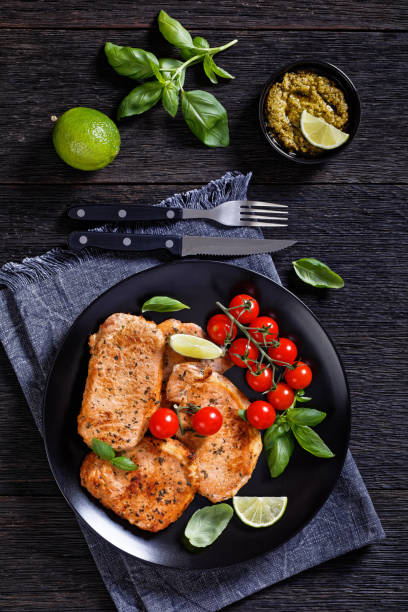 istock tomato basil pesto fried pork cutlets on plate 1403424930