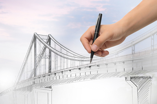 Man drawing picture of bridge, closeup. Business cooperation concept