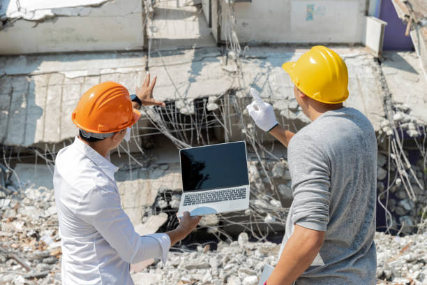 istock Demolition control supervisor and foreman discussing on demolish building. 1403425025