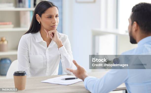 Mixed Race Hiring Manger In Interview With Businessman Ceo With Resume And Cv Of Candidate Looking For Job Opening Vacancy Office Opportunity Applicant Sitting And Explaining Experience To Hr Boss Stock Photo - Download Image Now