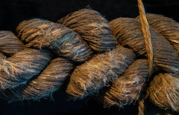 istock Rope jute tackle texture on black background 1403425357