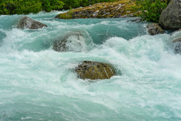 istock Blue spring water stream, Norway, Briksdal. National park Jostedalsbreen. 1403425462