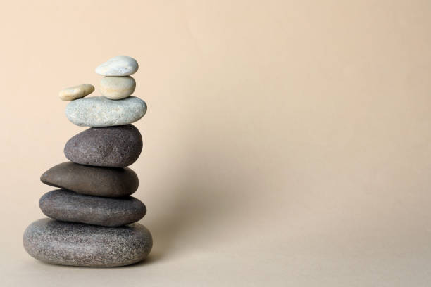 istock Stack of stones on beige background, space for text. Harmony and balance concept 1403426516