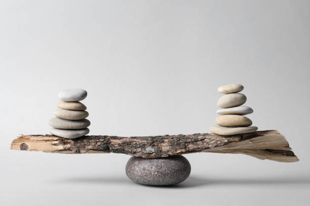 istock Tree branch with stones on grey background. Harmony and balance concept 1403426710