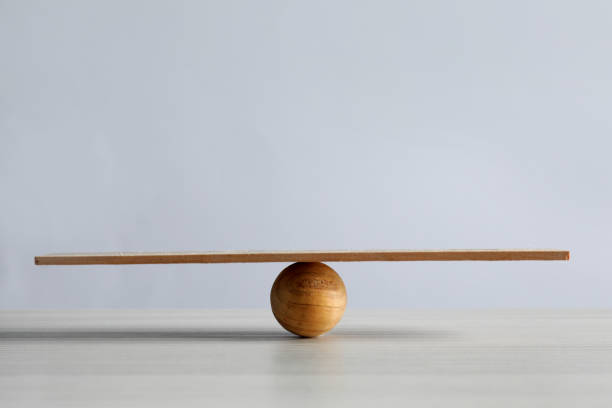 istock Wooden ball with small plank on table, space for text. Harmony and balance concept 1403426920
