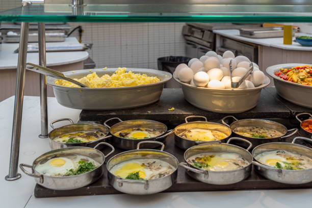 istock Egg buffet with hard boiled, scrambled, shakshuka and egg with white sauce and mushrooms plus potatoes and vegetables. 1403427977