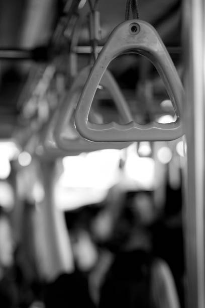 istock Rows of handles on airport buses. 1403428391