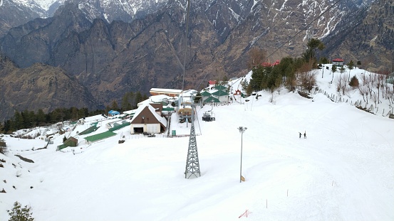 Scenic snow-capped view of Auli \nBest Ski, Pilgrimage destination of India: Auli is situated in Uttrakhand in the lap of Nanda Devi Hills of the Himalayan mountain range.