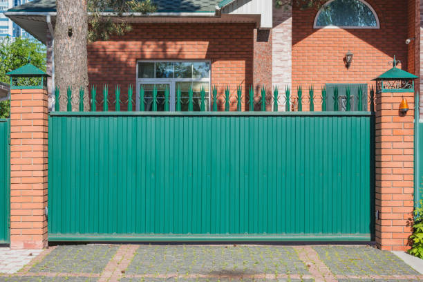istock Metallic new gate by the house. 1403436716