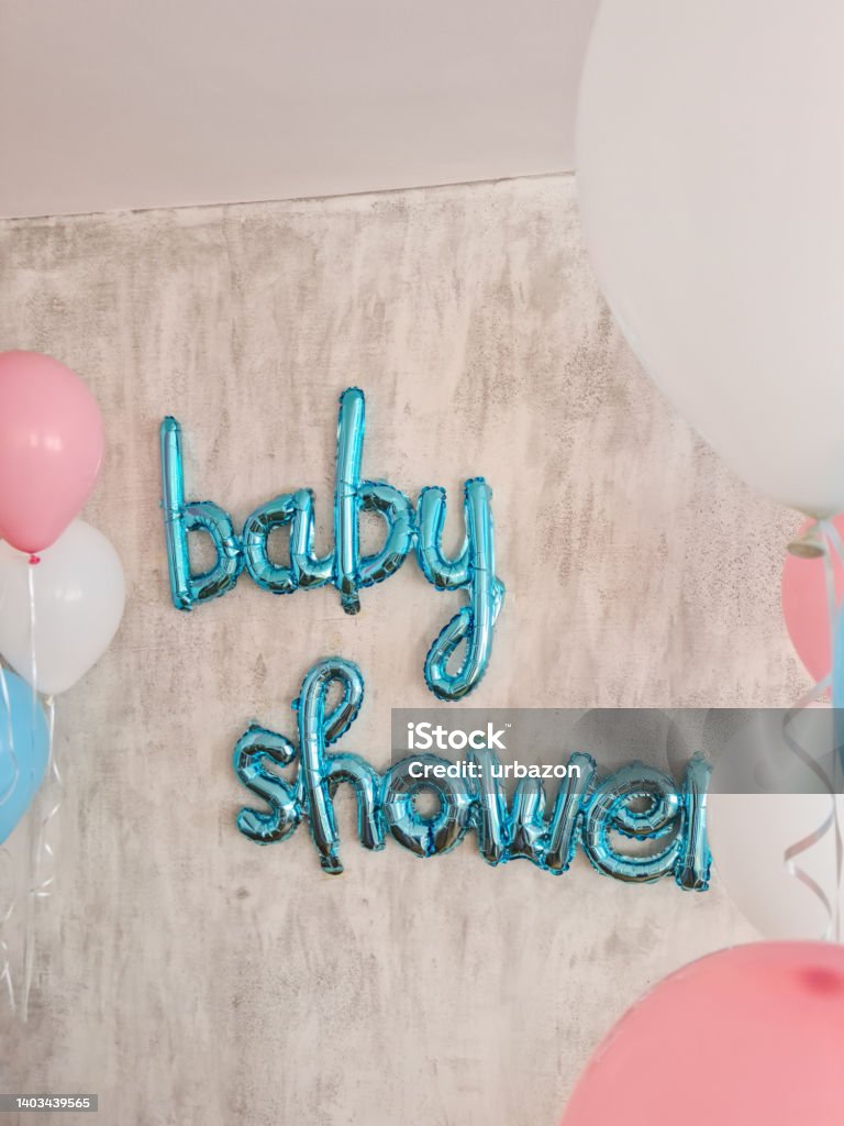 Baby Shower Balloon Sign Blue baby shower balloon sign on the wall indoors. Arrival Stock Photo