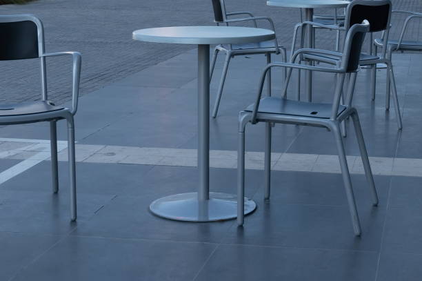 istock a round table with chairs are standing on the street 1403443622