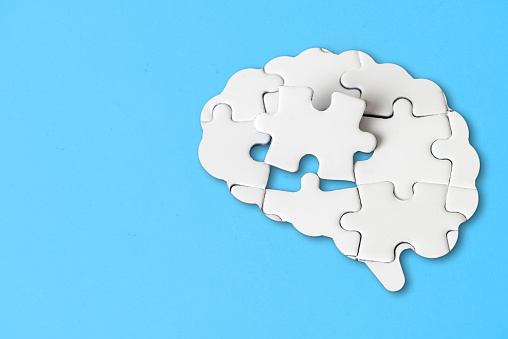 Missing piece in the brain shaped jigsaw puzzle fits into place.