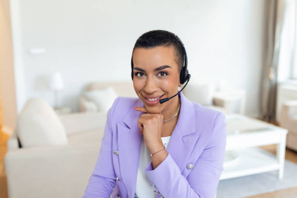 istock Business woman with headsets working with computer at office. Customer service assistant working in office.woman operator working with headsets and laptop at telemarketing customer service. callcenter 1403444454