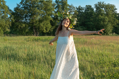 https://media.istockphoto.com/id/1403446748/photo/woman-dance-ecstatic-dance-in-field-woman-in-flower-wreath-summer-solstice-day.jpg?b=1&s=170667a&w=0&k=20&c=_d7AcIpLJFwzLXJt7hO9ZWASzl-EtXUSmlTiQ2bYuy0=