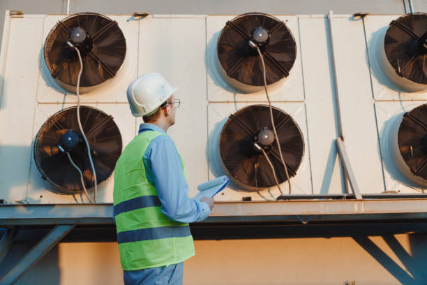 istock Service hvac engineer in uniform inspecting industrial refrigeration system 1403447045
