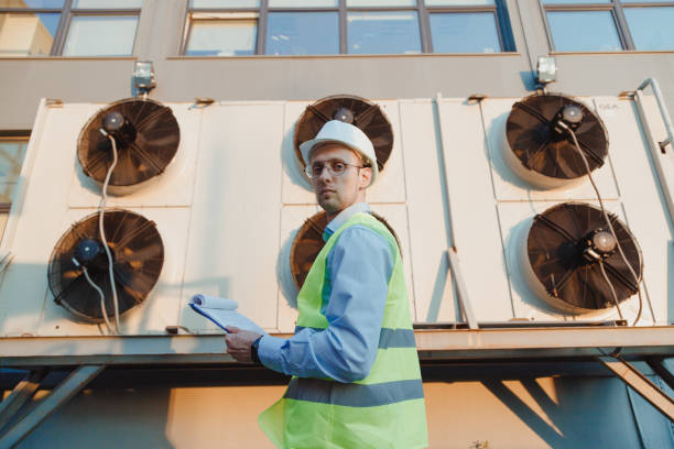 istock Service hvac engineer in uniform inspecting industrial refrigeration system 1403447049