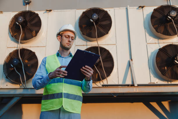istock Service hvac engineer in uniform inspecting industrial refrigeration system 1403447053