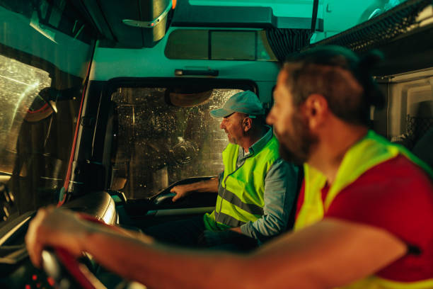 istock Trucker backing up to hook trailer 1403447218