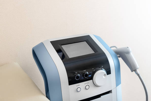 Closeup detail view of modern extracorporeal shock wave ultrasound eswt treatment equipment medical office. Physiotherapy rehabilitation and treatment. Healthcare device and technology stock photo