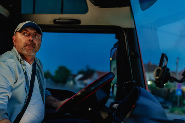 istock Middle-aged man driving a truck 1403447468
