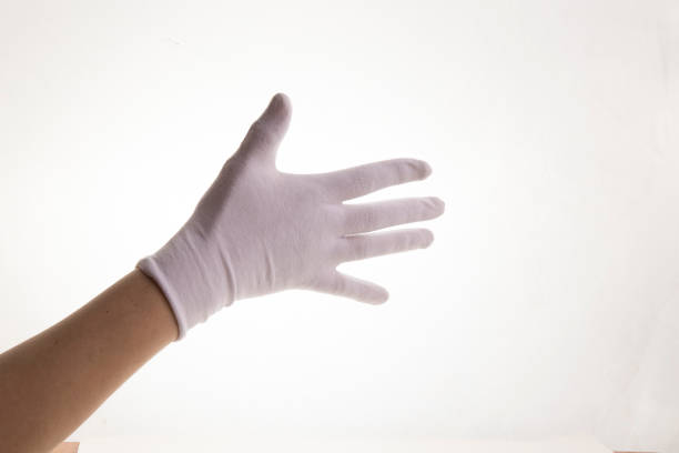 istock Hands gesticulating in white textile gloves on a white background 1403448557
