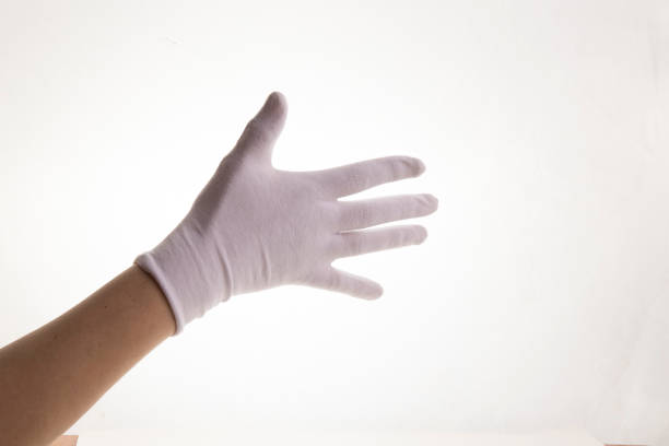 Hands gesticulating in white textile gloves on a white background stock photo