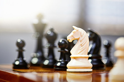 chess pieces on game board, detail photo, strategy game, horizontal position