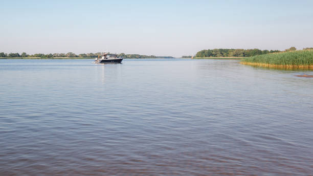 istock On a clear summer day, a small fishing boat returns home. 1403454199