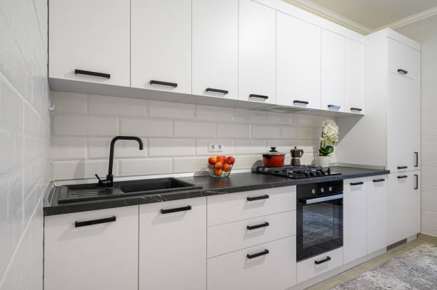 istock Trendy white modern kitchen interior with minimalistic furniture 1403454603