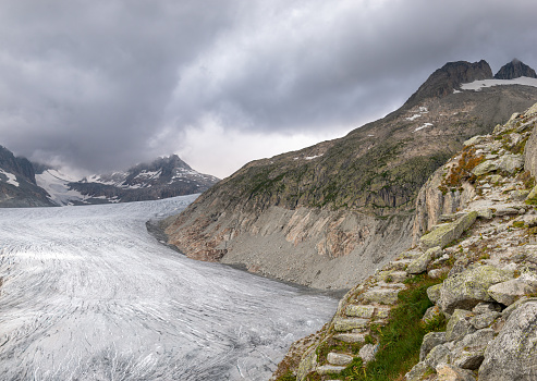 View of the glacier in the central swiss alps in the canton of valais. The Rhone Glacier is located above the famous Hotel Belvedere and can be reached via the Furka Pass. The glacier is in the headwaters of the rhone