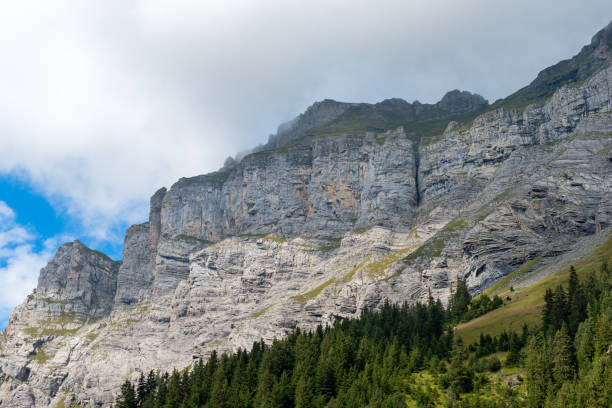 istock a mountain top surrounded by thick clouds in the swiss alps 1403455609