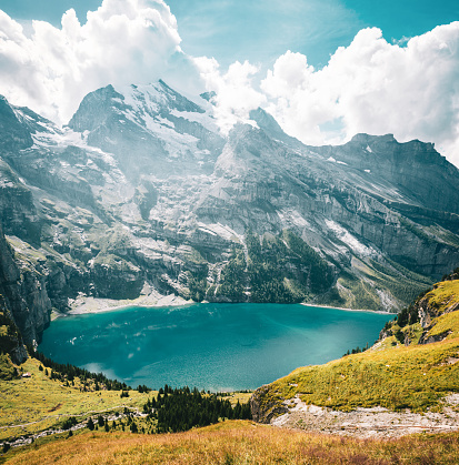 istock Mountain landscape and the lake Oeschinensee 1403455795