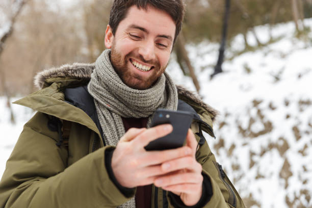 istock Handsome young man wearing winter jacket 1403458277