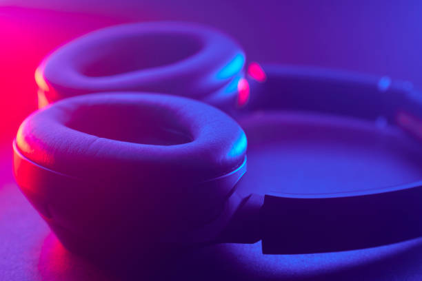 Close up of audio headphones with red and blue gradient led lights