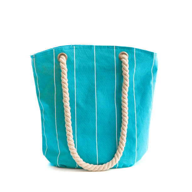 Blue beach bag Blue beach bag isolated on white beach bag stock pictures, royalty-free photos & images