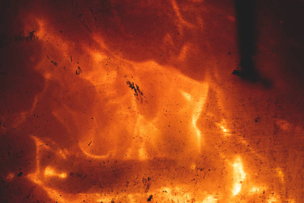 Flame of fire on a black background, fire behind glass