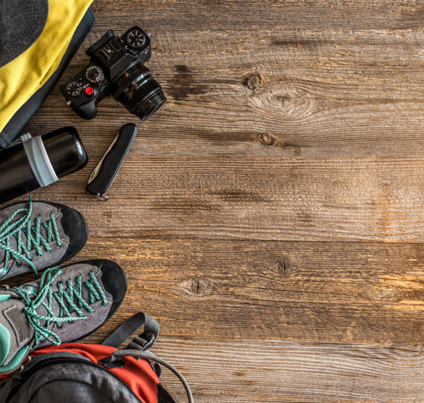 istock Trekking equipment on wooden background 1403465095