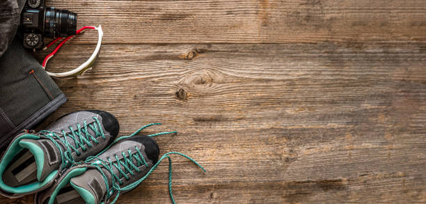 istock Trekking shoes, sunglasses and camera 1403465097