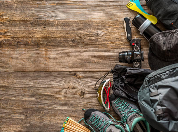 istock Trekking equipment on wooden background 1403465131