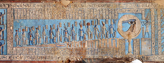 Hieroglyphic carvings and paintings on the interior walls of an ancient egyptian temple in Dendera