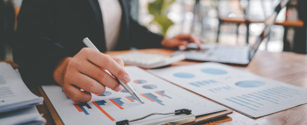 istock Portrait of a woman working on a tablet computer in a modern office. Make an account analysis report. real estate investment information financial and tax system concepts 1403474898