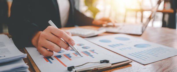 istock Portrait of a woman working on a tablet computer in a modern office. Make an account analysis report. real estate investment information financial and tax system concepts 1403475203