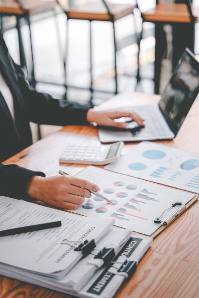 istock Portrait of a woman working on a tablet computer in a modern office. Make an account analysis report. real estate investment information financial and tax system concepts 1403475808