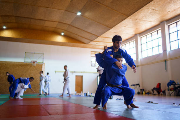 istock Martial arts fighters training together 1403476180