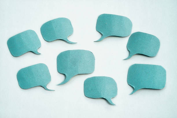 istock Group of blue paper speech bubbles with copy space 1403476686