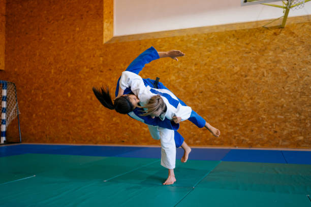 istock Two young females practicing judo together 1403476951