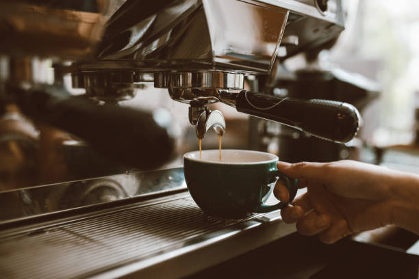 istock Selective focus barista making coffee with professional machine, Coffee pouring into a cup, small business, startup business. 1403477881