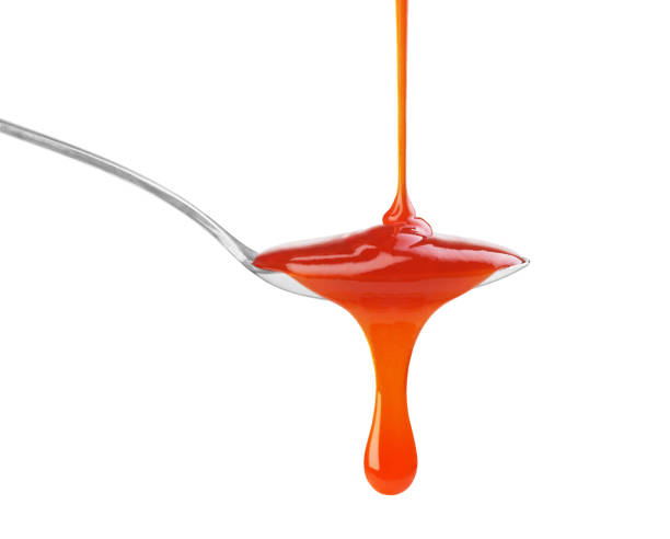 istock drip of red sauce in a spoon on a white background 1403477971