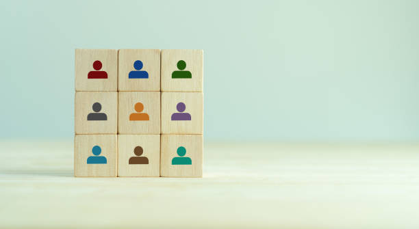 istock Team building and diversity concept. Work collaboration for achieving goal and successful business. Productive people skills. Wooden cubes with team diversity building icons. HRM Banner. 1403478136